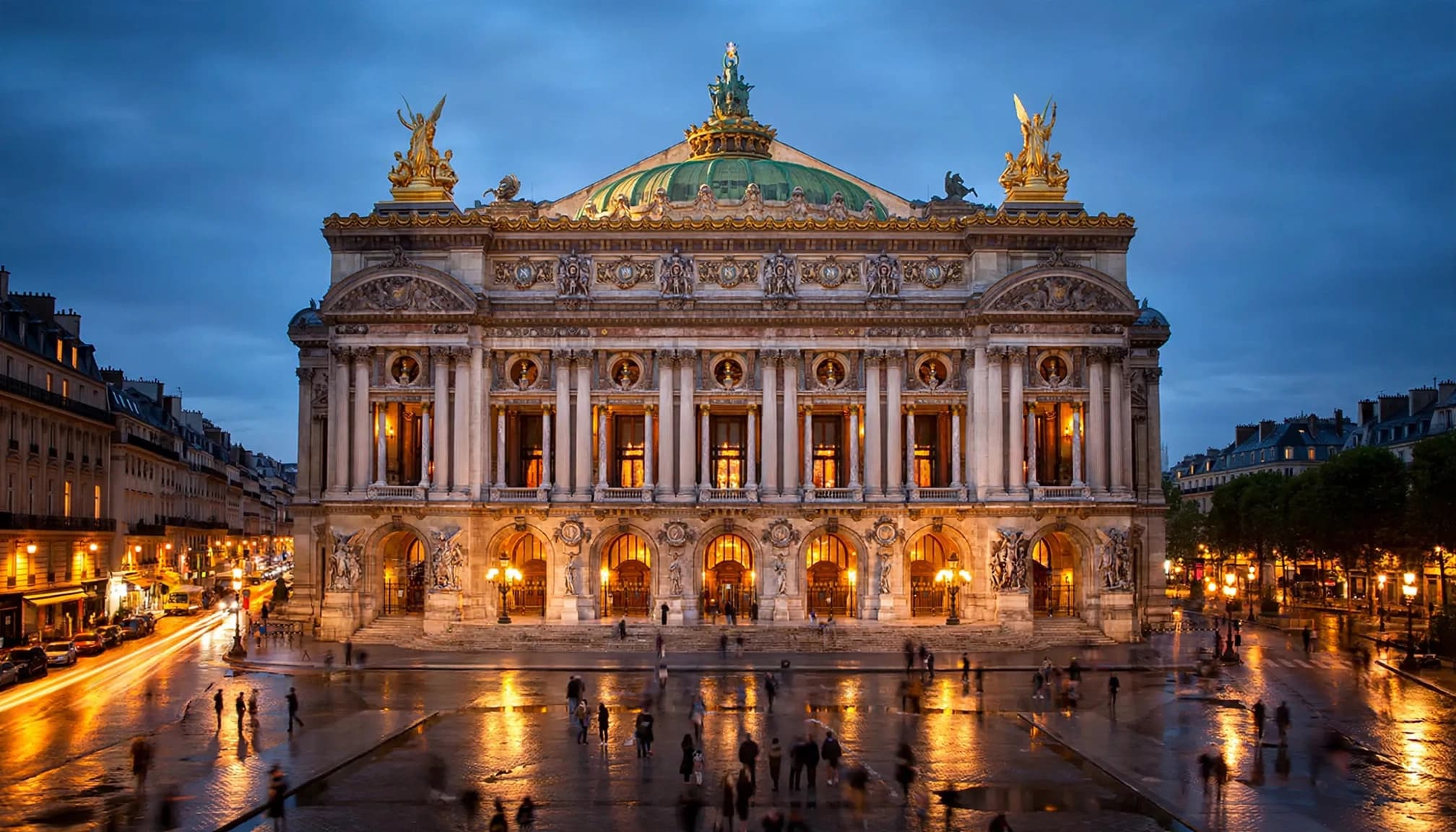 The Palais Garnier overlooks Place de l'Opéra at twilight.
